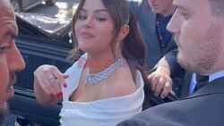 Selena Gomez dazzles on the Cannes Film Festival red carpet in a stunning white dress.