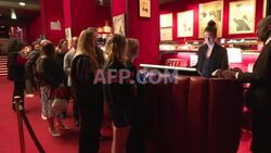 Newly-wed American veteran and wife honeymoon at Moulin Rouge - AFP