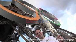 Olympic Torch Heads To The Top Of The Eiffel Tower