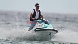 *EXCLUSIVE* Music mogul/TV personality Simon Cowell seen on a jet ski enjoying some water sports with his family during a summer break in Barbados