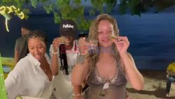 *EXCLUSIVE* Mega star Rihanna enjoys a few drinks with her close friends at Thunder Bay Bar in Western Barbados