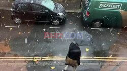 London sees its first snowfall of the season - AFP