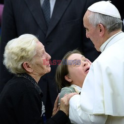 Pope Francis recives a caress from a disabled man 