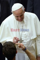 Pope Francis recives a caress from a disabled man 