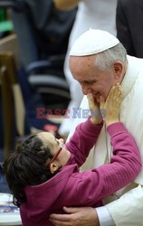 Pope Francis recives a caress from a disabled man 